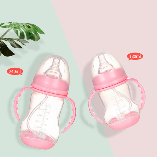 Two pink baby bottles with measurements, one 240ml and the other 180ml, each with handles and clear nipples. They are placed on a split pastel background with a green leaf decoration.