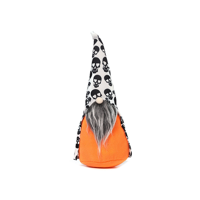 A Halloween-themed gnome with a tall, pointed hat featuring a black skull pattern on white fabric. The gnome has a gray beard and an orange body, standing upright against a plain white background.