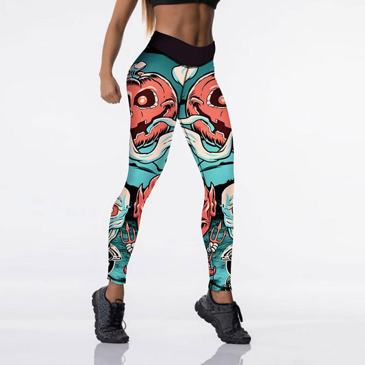 Woman wearing colorful leggings with bold, abstract eye and face designs. The leggings are paired with a black sports bra and black sneakers on a white background.
