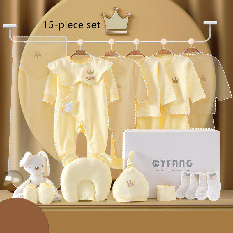 Yellow 15-piece baby gift set with onesies, jackets, hat, socks, mittens, and plush toys. Displayed on hangers and alongside a box labeled "CYFANG" on a beige background.
