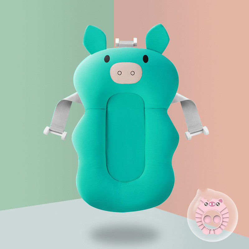 Turquoise pig-themed baby bath cushion with adjustable straps, designed for infant support and comfort during bath time. Set against a split pastel background with a circular pink detail.