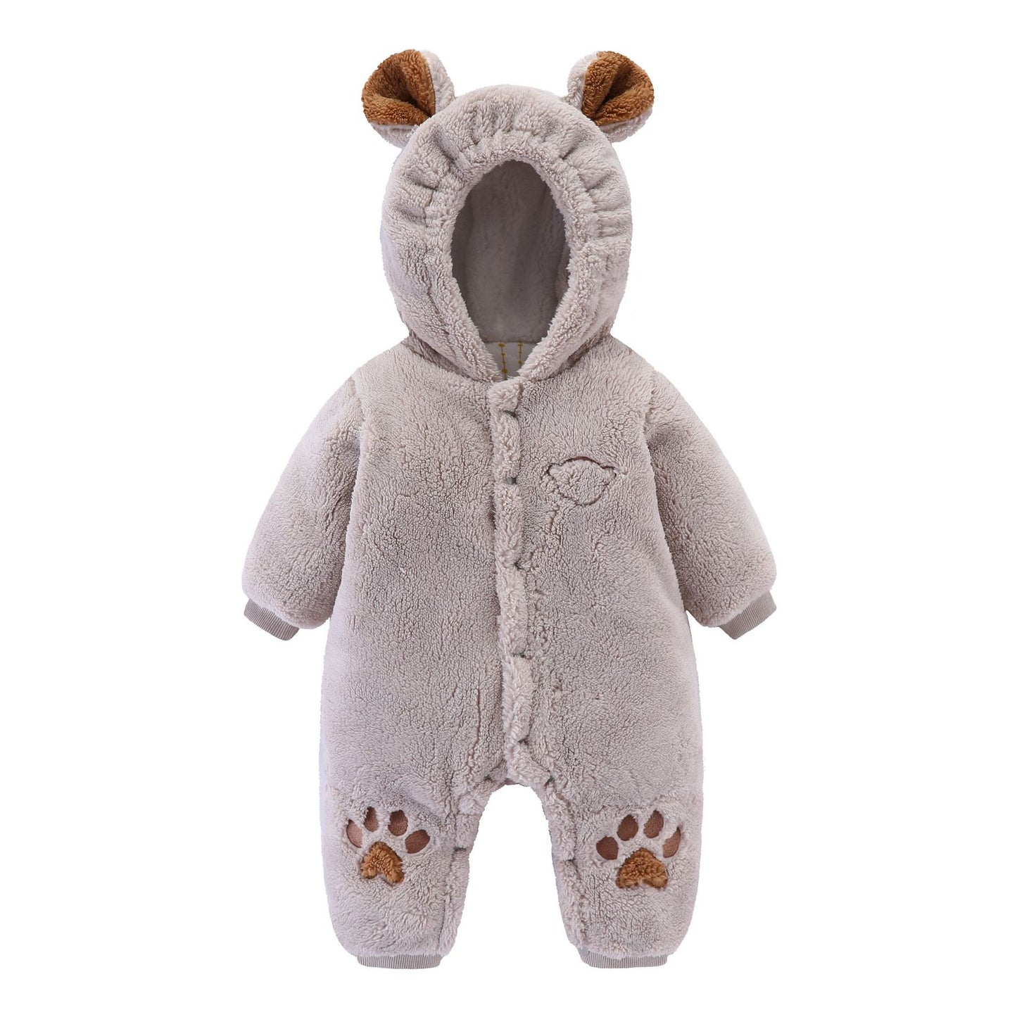 Soft, beige baby onesie resembling a bear, with small ears on the hood and brown paw prints on the feet. The fuzzy texture adds a cozy feel, ideal for warmth.