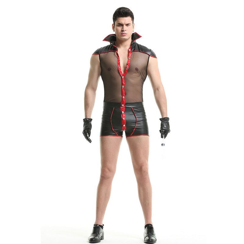 Man in a mesh shirt with red trim, black high-waisted shorts, black gloves, shoes, and a confident pose against a white background.