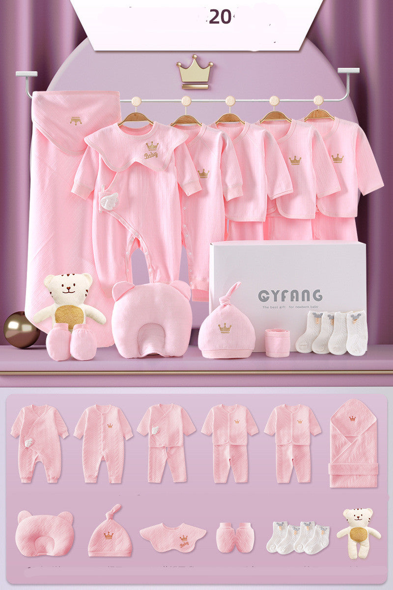 Baby pink clothing set for newborns includes onesies, jackets, caps, mittens, socks, and a blanket. Features a crown design. Also includes a plush bear and pillow.