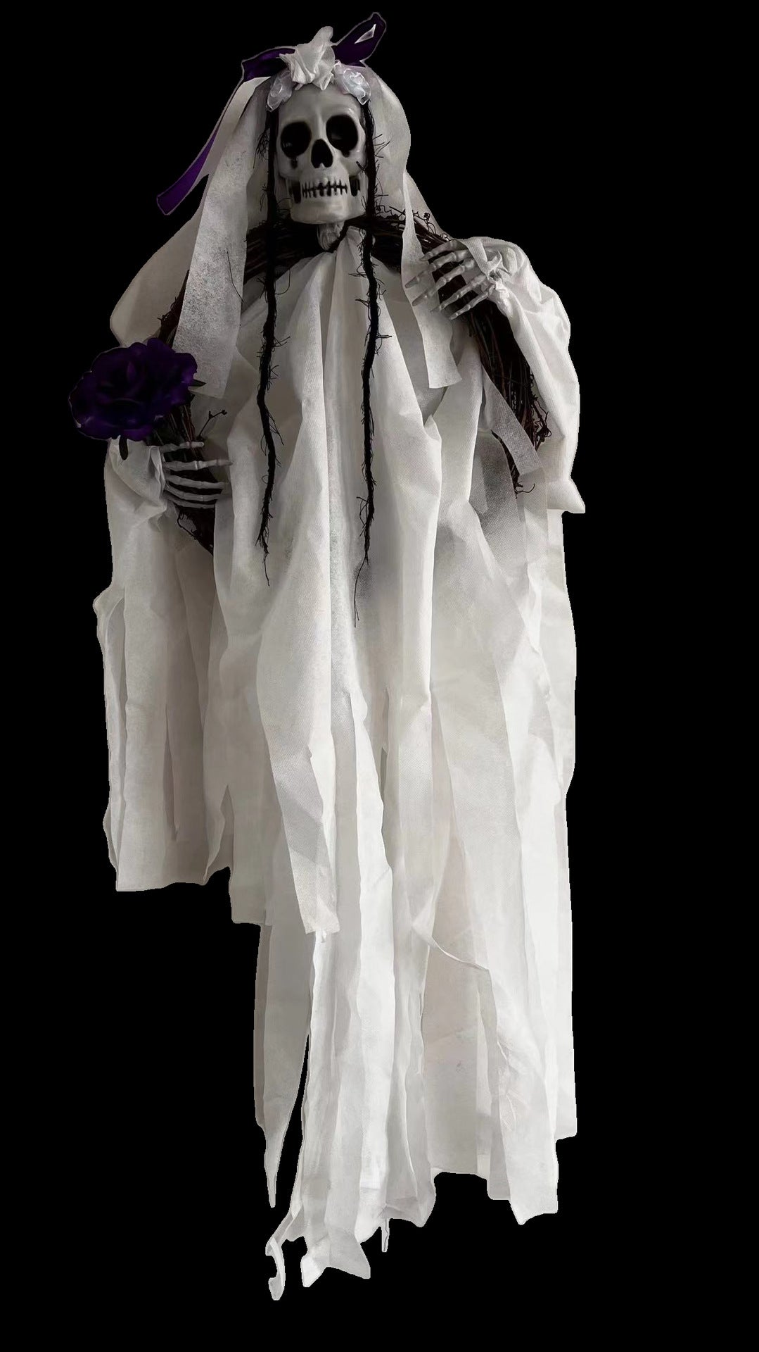 A skeletal figure dressed as a ghostly bride in tattered white robes with a veil and a purple ribbon. The figure holds a dark purple flower and has black hair strands. Set against a black background, the detailed skull features hollow eyes and a toothy grin, giving a haunting appearance.