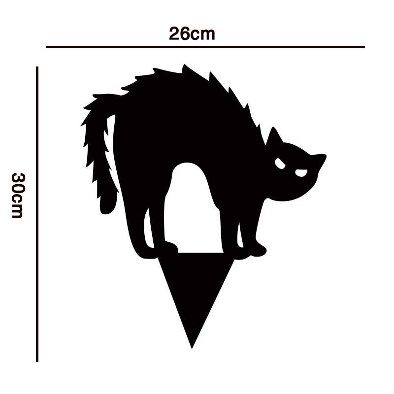 Silhouette of an arched black cat with raised tail, measuring 26cm wide by 30cm tall, standing on a pointed base against a white background.