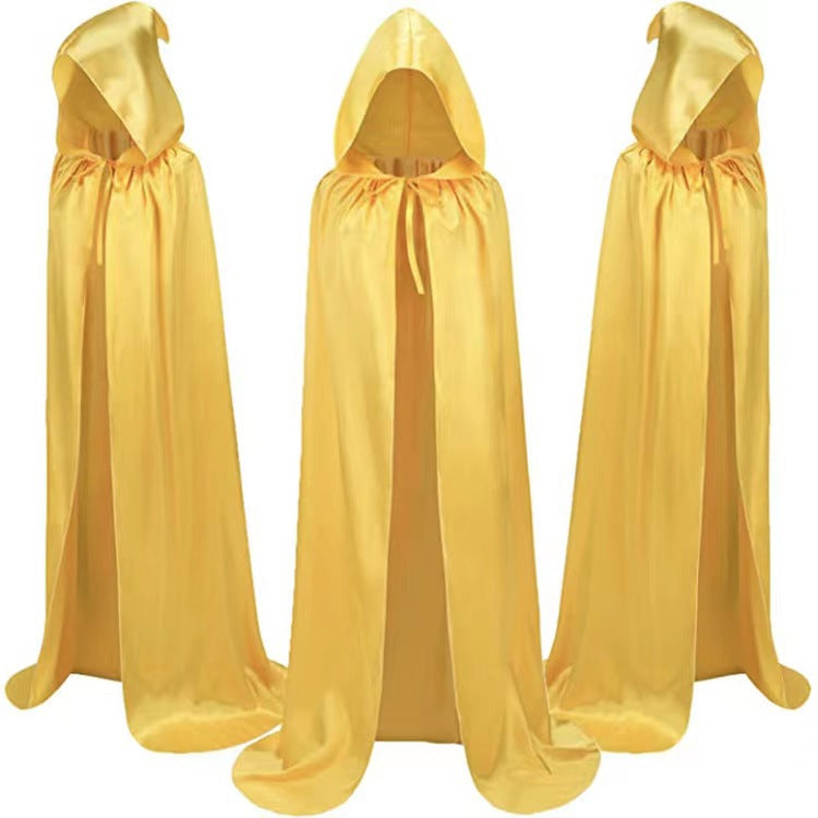 Three identical golden hooded capes displayed in a row, showcasing their shiny fabric and flowing design, each with a simple tie closure at the neck.