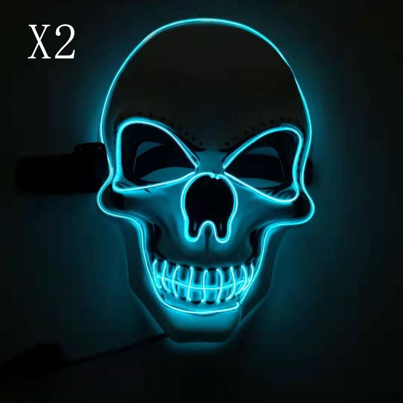 Glowing skull mask outlined in bright blue neon lights against a dark background. The design features hollow eyes and a toothy grin. Text "X2" is in the top left corner.