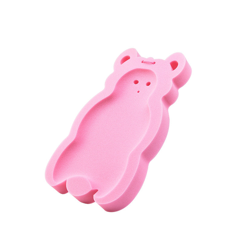 Pink bear-shaped silicone cake mold with cutout details for face and ears.