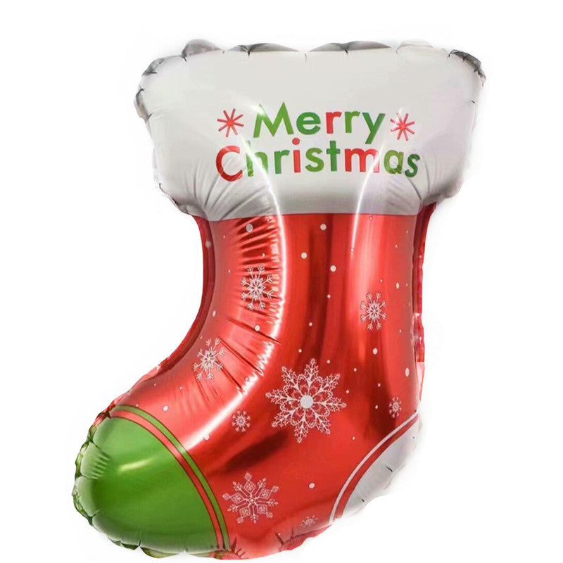 Red and green inflatable Christmas stocking with "Merry Christmas" text in red and green at the top. Decorated with white snowflakes and a green toe.