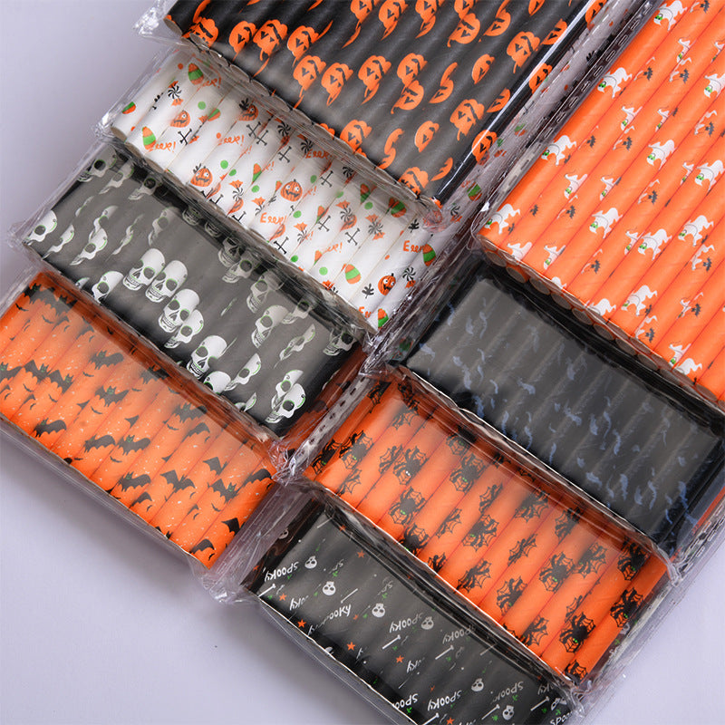 Assorted Halloween-themed paper straws in packs, featuring designs of pumpkins, bats, skulls, candy corn, ghosts, and the word "Spooky" on orange, black, and white backgrounds.