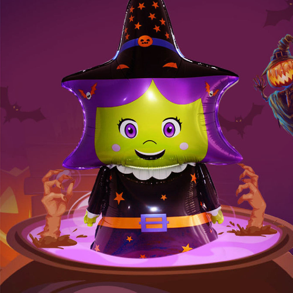 Cartoon witch balloon with purple hat and hair, green face, and a smiling expression stands in a cauldron of purple liquid surrounded by spooky background elements.