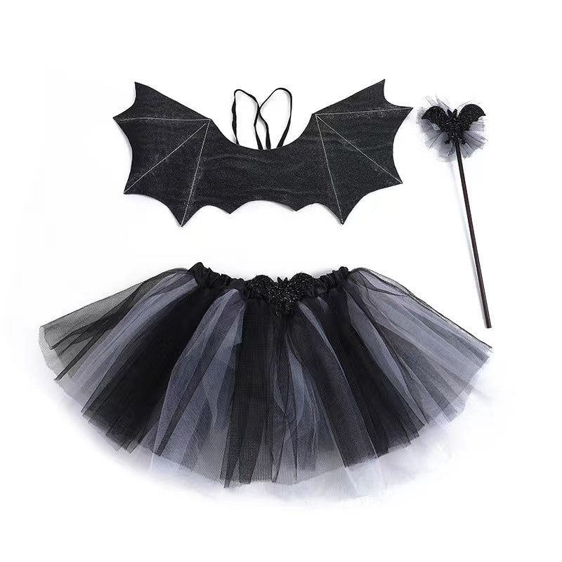Black bat-themed costume set with wings, tulle skirt, and wand. Wings are black with white accents, the skirt is layered with black and gray tulle, and the wand has a bat and tulle design.