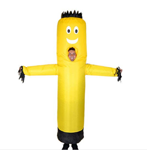 Person wearing a yellow inflatable tube man costume with a smiling face and black hair-like fringe, standing with arms outstretched, against a white background.