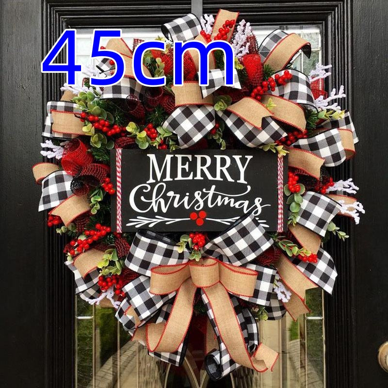 Festive Christmas wreath with black-and-white checkered and burlap ribbons, red berries, greenery, and a "Merry Christmas" sign on a black door. Size noted as 45cm.