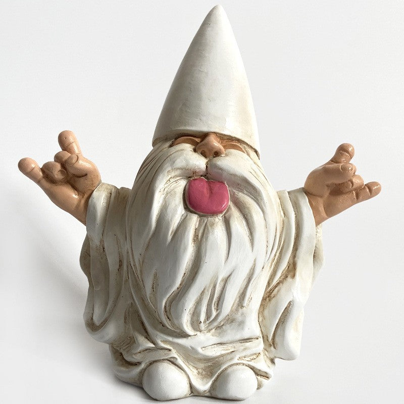 Ceramic gnome with a long white beard and pointed hat, making a playful expression with its tongue out and hands showing the "rock on" gesture, set against a plain background.