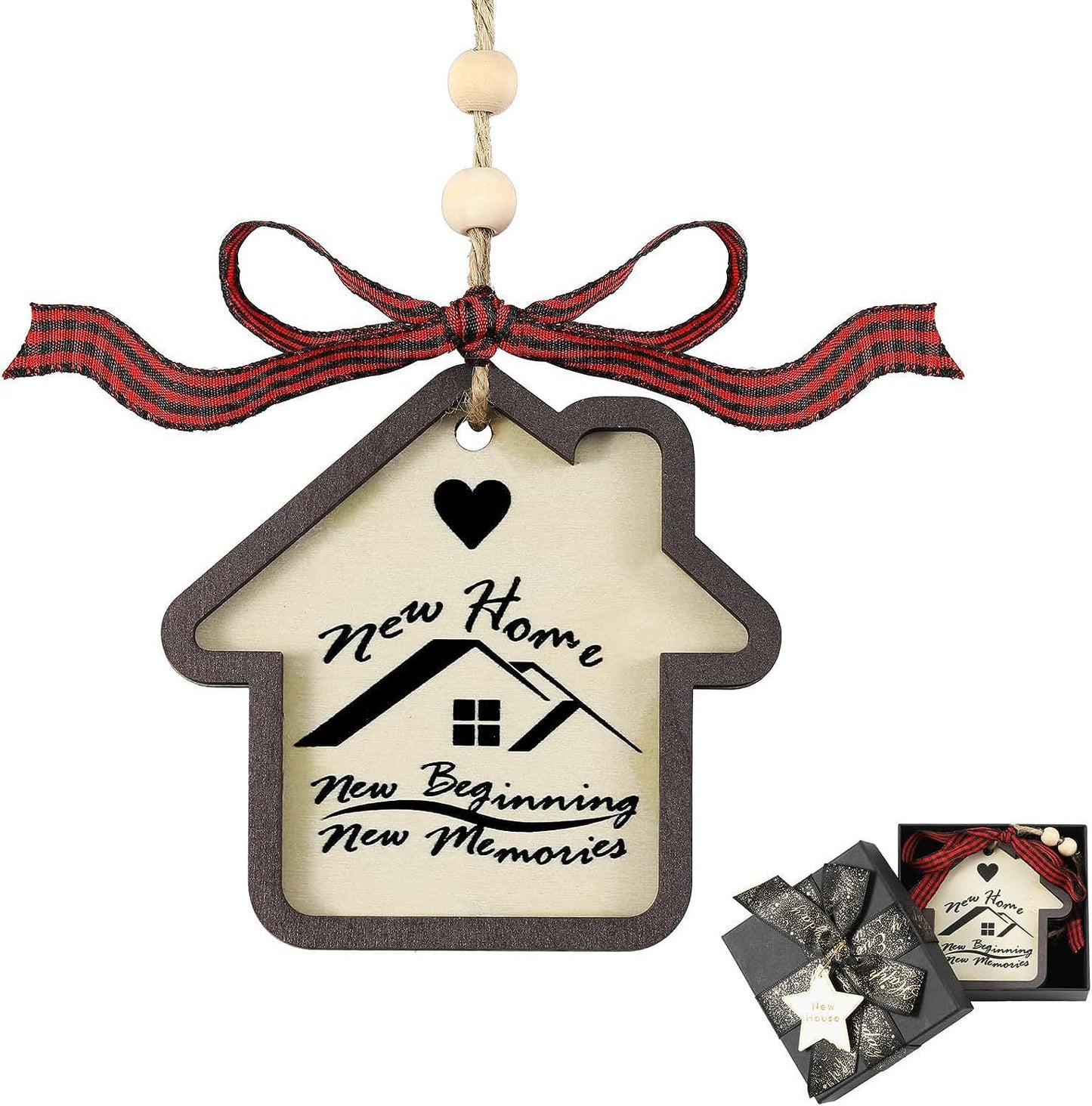 Wooden house-shaped ornament with "New Home, New Beginning, New Memories" text, a heart design, and a red plaid bow. Comes in a gift box with black ribbon and gold tag.