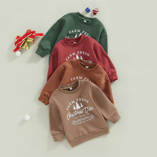 Four sweatshirts in green, red, brown, and beige with "Farm Fresh Christmas Trees" print, surrounded by Christmas decorations like bells, ribbons, and small gift boxes.
