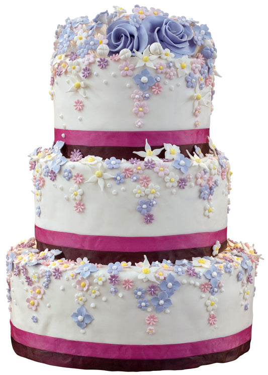 Three-tiered wedding cake with white icing, decorated with pastel sugar flowers and purple roses. Each layer is accented with dark and light pink ribbon bands.